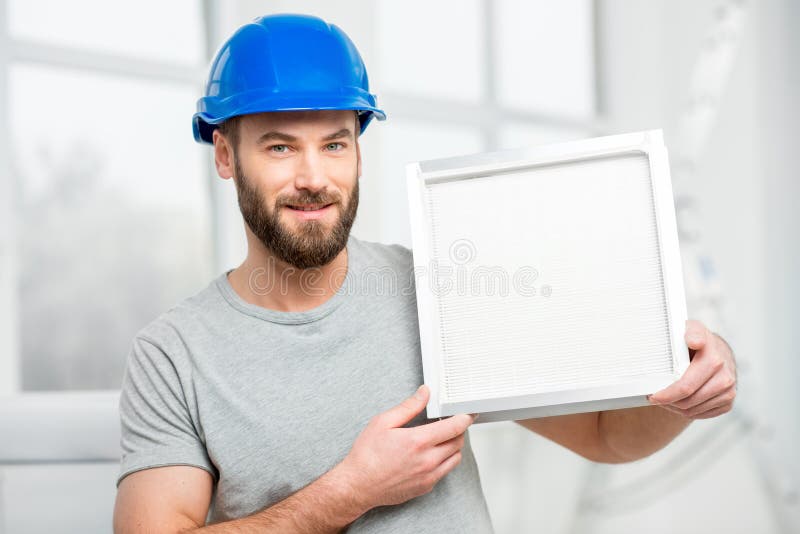 Worker with air filter stock image. Image of hvac, holding 85205869