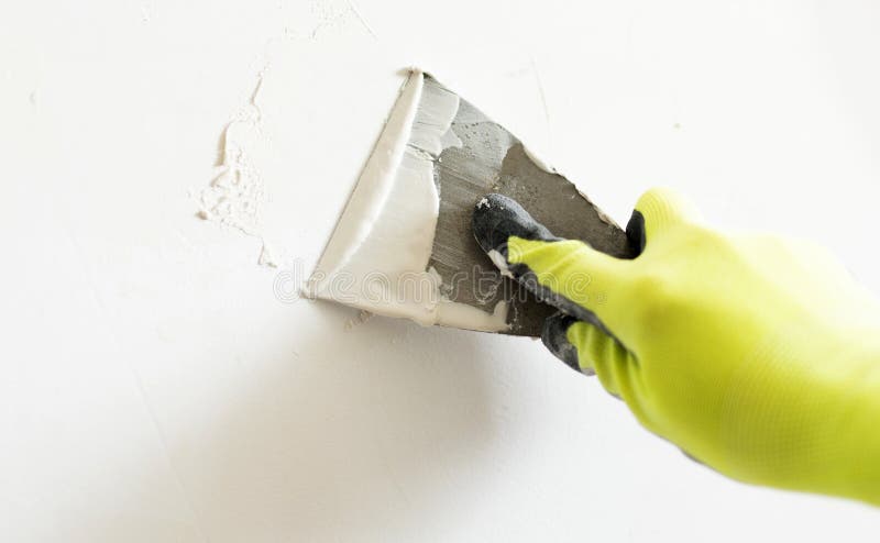 Worker Applying Wall Putty With Spatula royalty free stock image