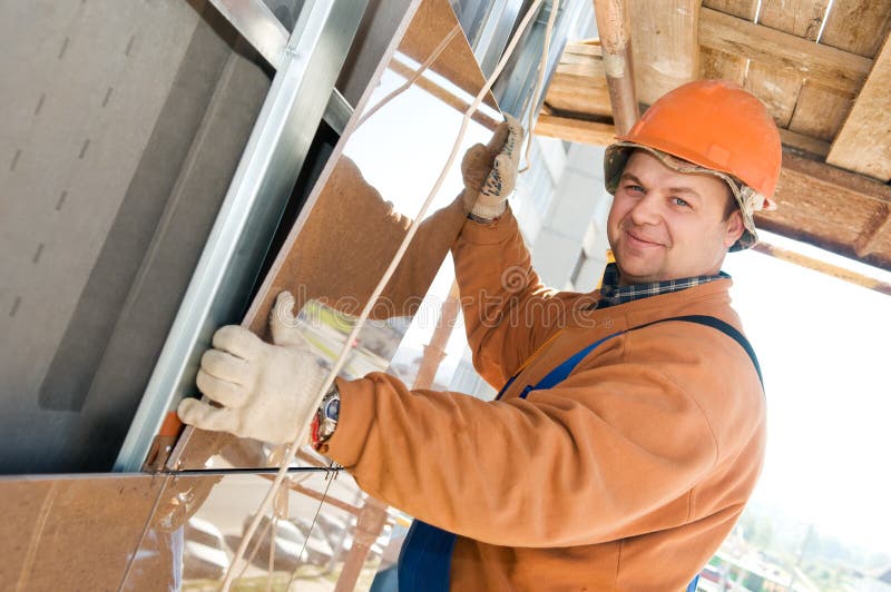 Worker builder at facade tile