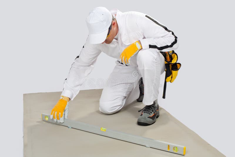 Worker checks levels of cement-base