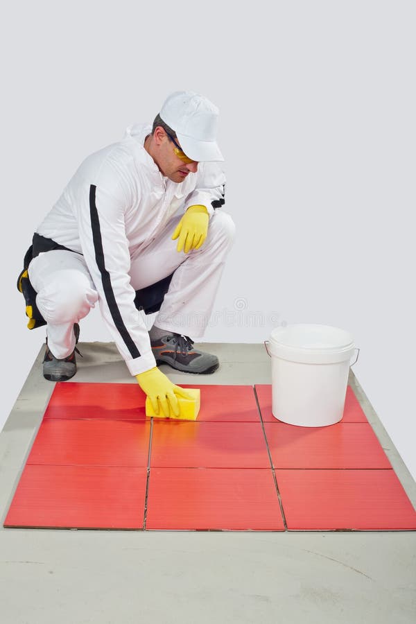 Worker clean red tiles stock photo. Image of repairman 27138388