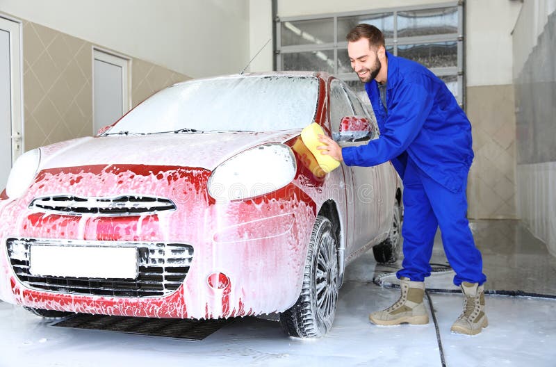 Worker Cleaning Automobile at Professional Car Wash Stock Photo Image