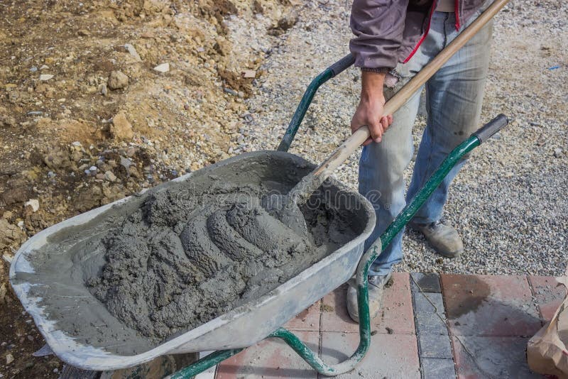 Worker with Concrete Mortar in Wheelbarrow Stock Photo Image of