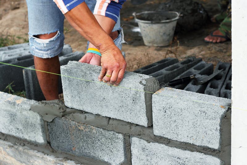 Worker Construction Laying Concrete Blocks Stock Photo