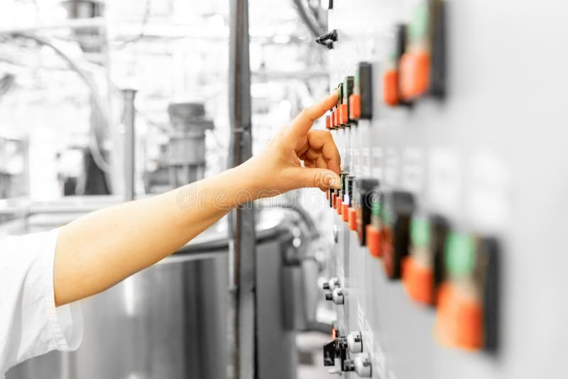 Worker controls automatic machines and production, finger presses industrial button. Controls automation stock images, royalty-free photos and pictures