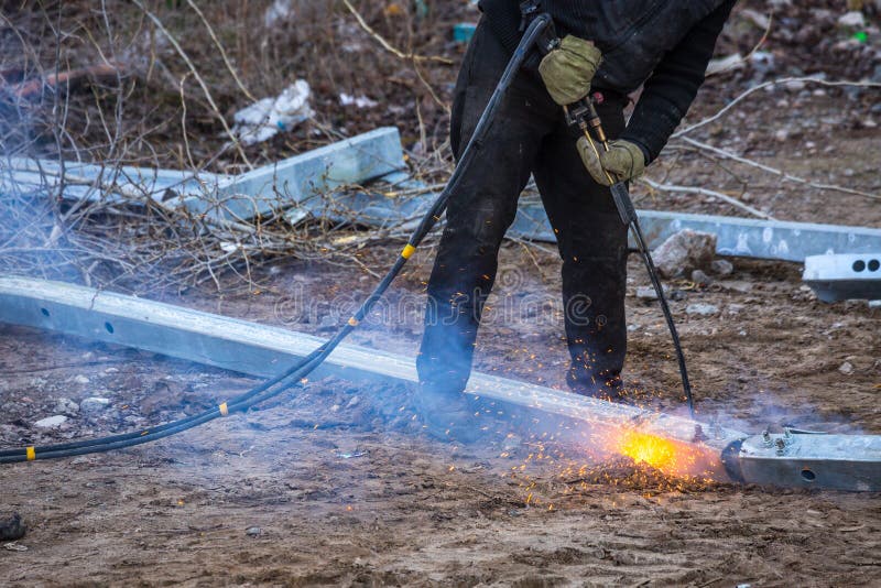 A Worker Cut Steel Beams Using Propane-oxygen Torch. Stock Image
