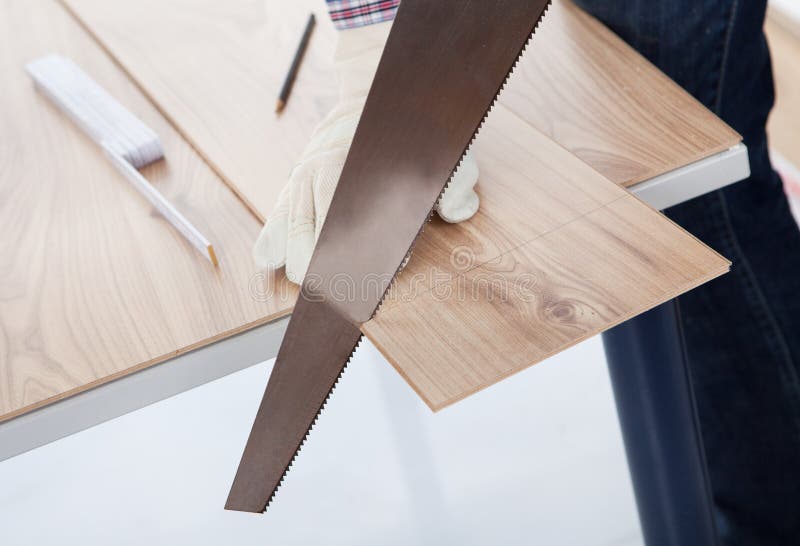 Worker cutting piece of laminate royalty free stock image Worker cutting piece of laminate royalty free stock image