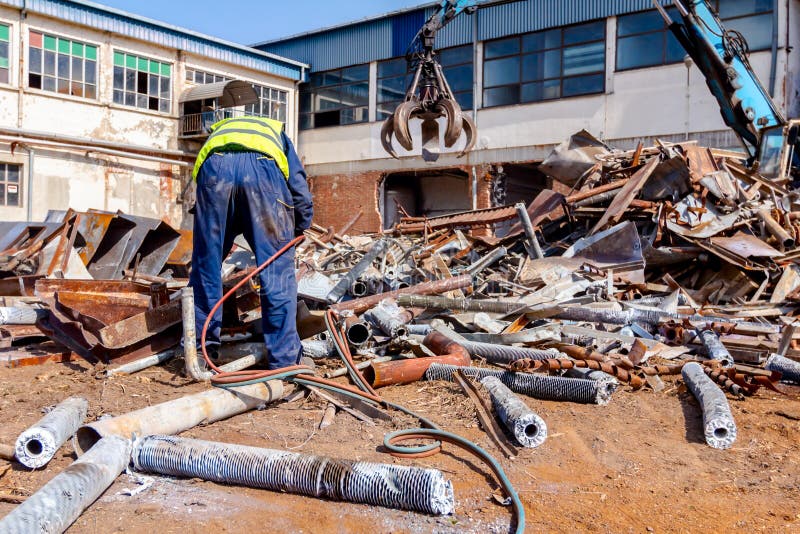 Worker is Cutting Scrap Metal with Acetylene Torch Stock Image - Image