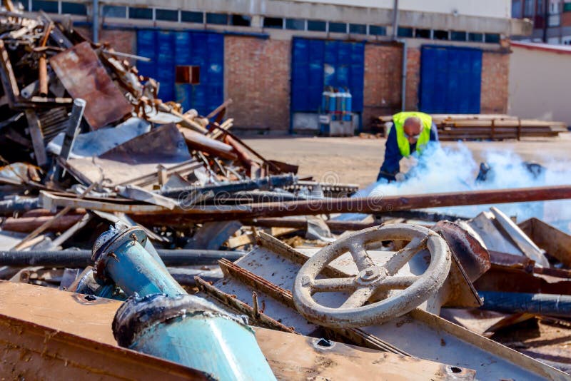 Worker is Cutting Scrap Metal with Acetylene Torch Stock Image - Image