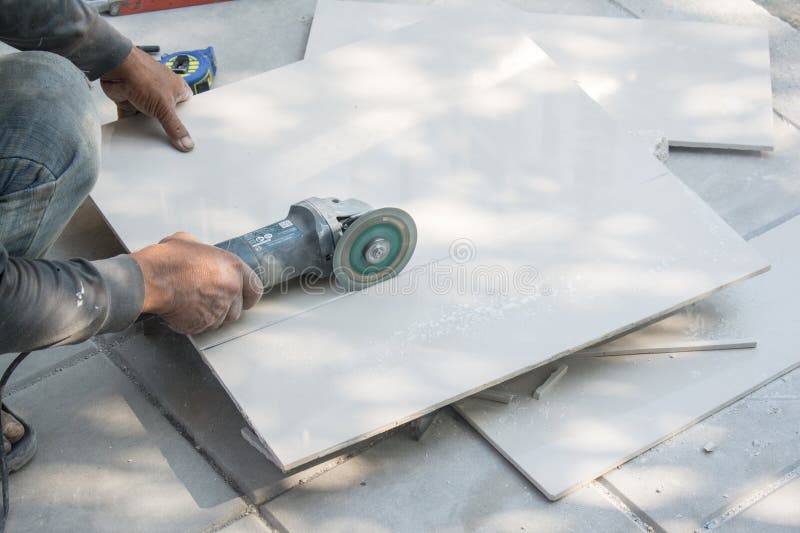 Worker Cutting a Tile Using an Angle Grinder Stock Photo Image of