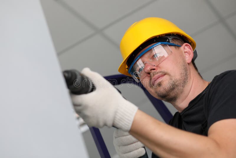 Worker with drilling machine stock photos Worker with drilling machine stock photos