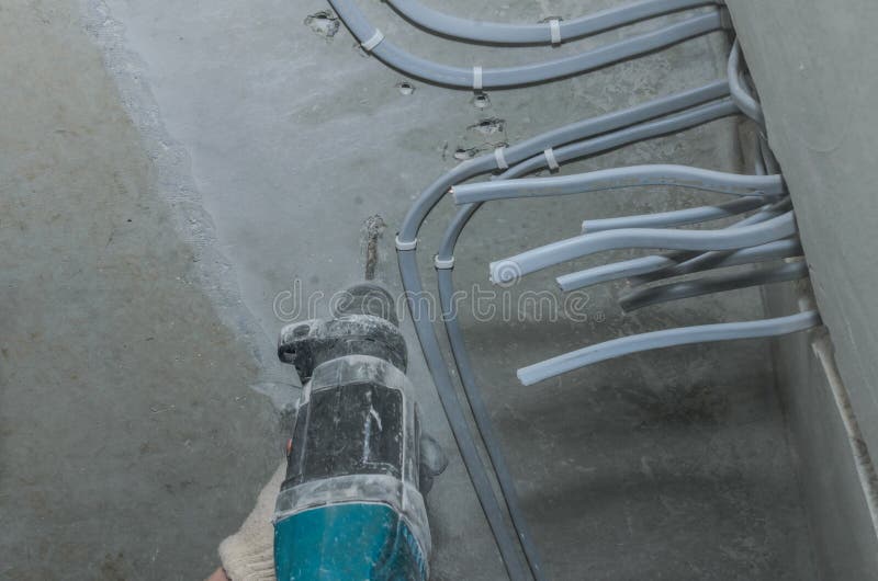 Worker Drills a Concrete Wall with a Hammer Drill Stock Image Image of drills, jackhammer