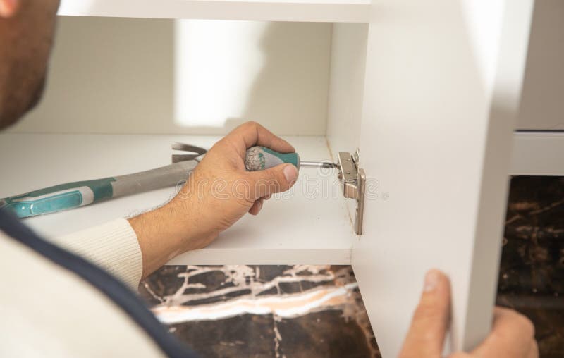Worker Fixing Kitchen Using Screwdriver Stock Photo Image of assembling, door 267133598