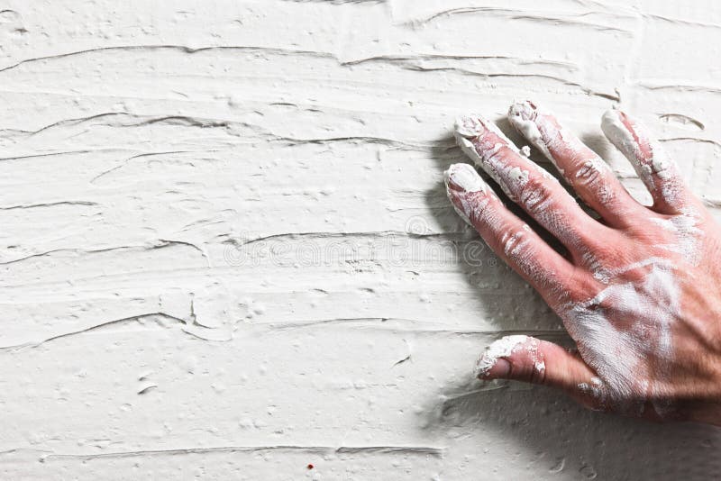 Worker Hand Stucco Plaster Wall Building Background Flat Lay Construction Repair Dirty White Concept. Worker Hand Stucco Plaster Wall Building Background Flat Lay Construction Repair Dirty White Concept