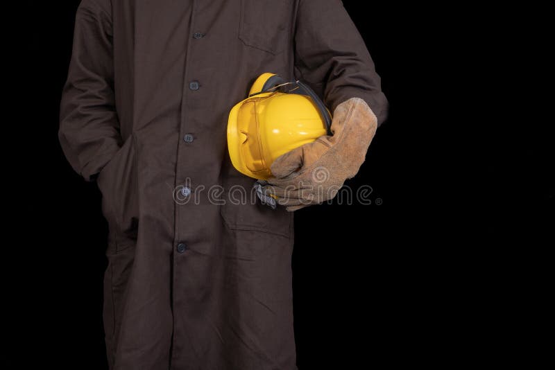 Worker with a Helmet in His Hand Wearing a Protective Apron. Health ...