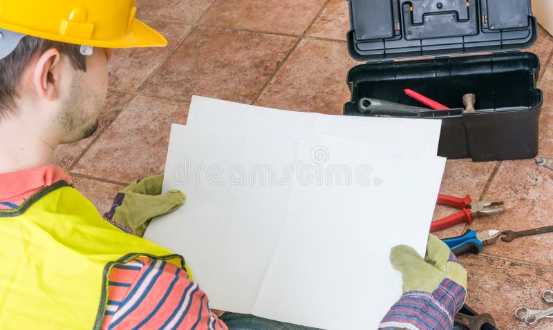 Worker is holding empty paper as a frame for custom message stock images