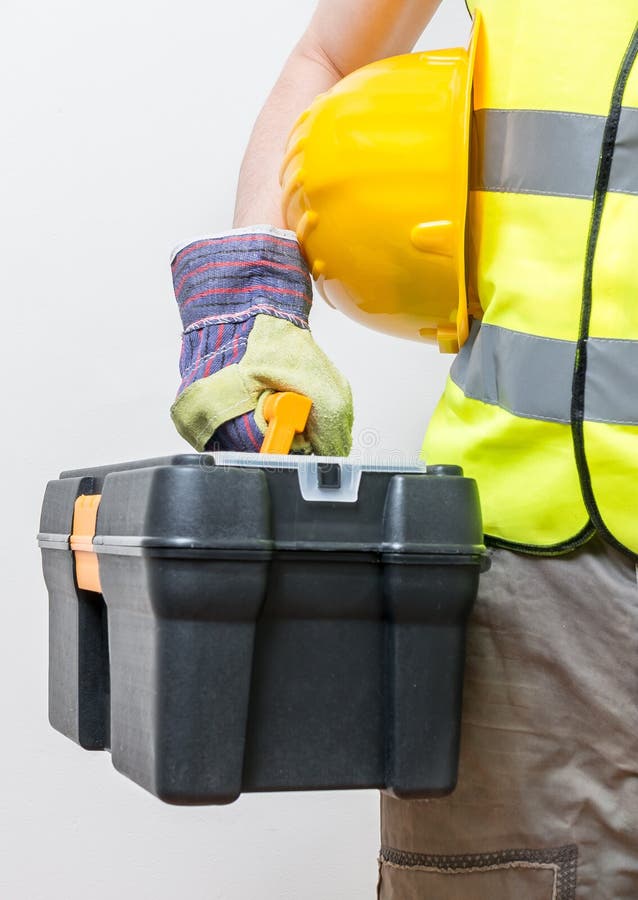 Worker holds toolbox. Construction concept royalty free stock photos