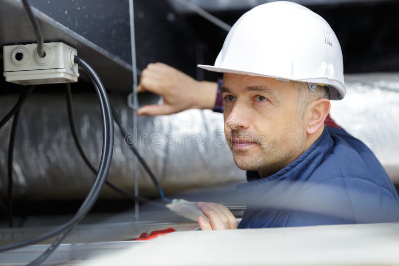 Worker Inspects Wiring for Ventilation Stock Photo Image of system