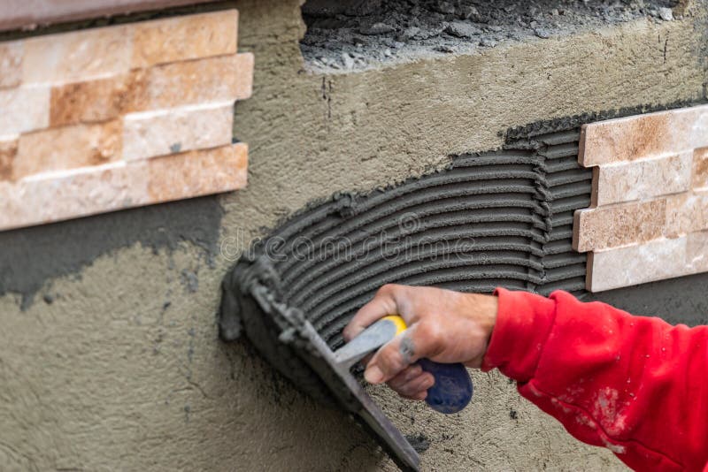 Worker Installing Wall Tile Cement with Trowel and Tile at Construction Site Stock Image Image