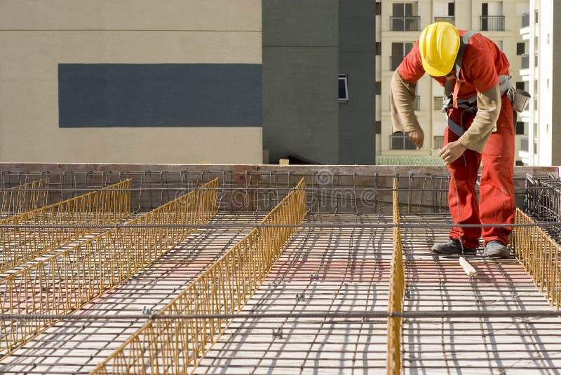 Worker Installs Rebar - Horizontal