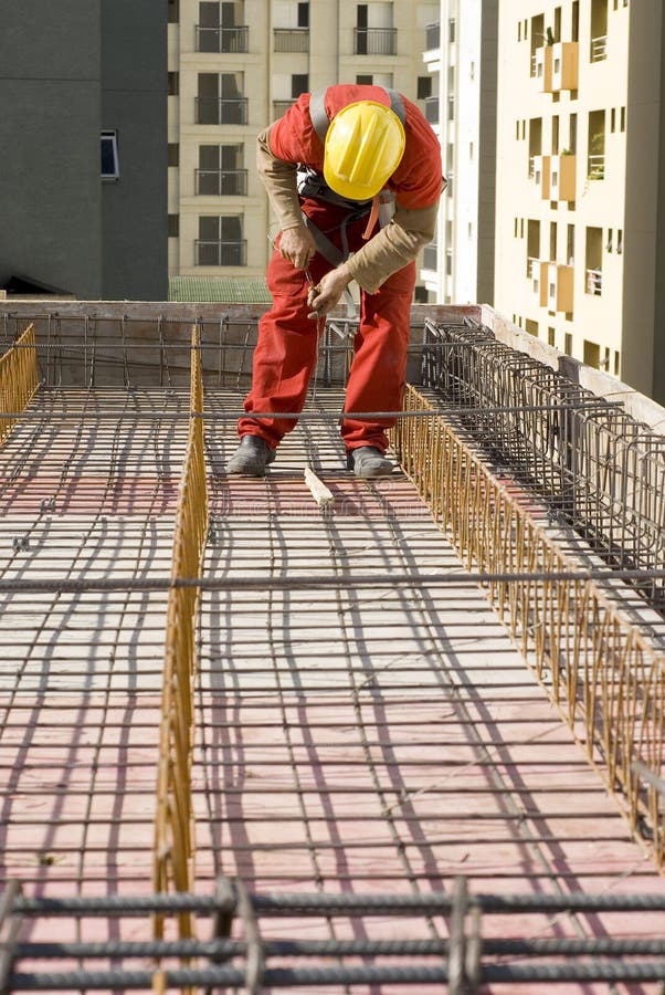 Worker Installs Rebar - Vertical