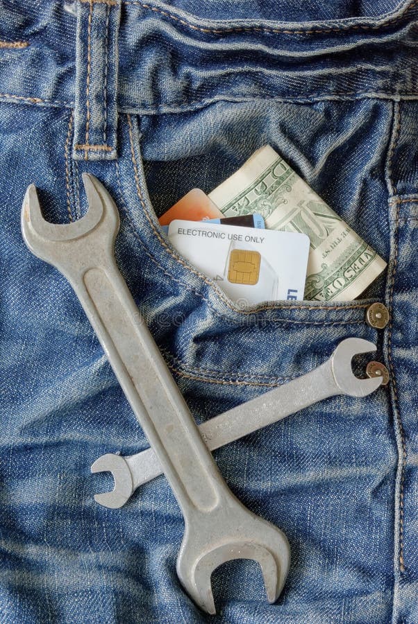 Worker jeans with money and tools