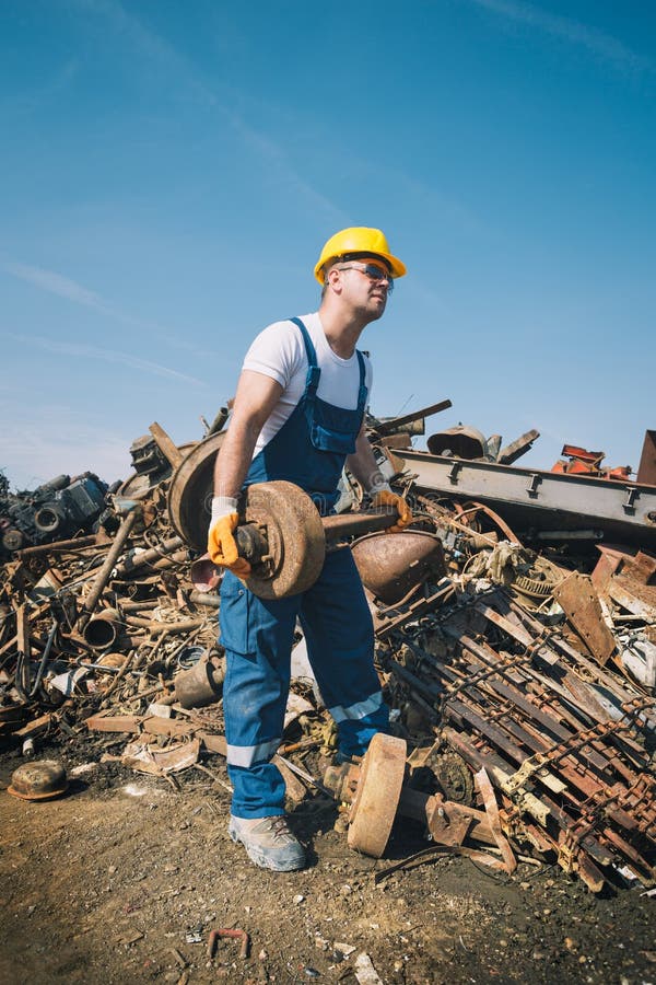 Worker in a junkyard royalty free stock photo