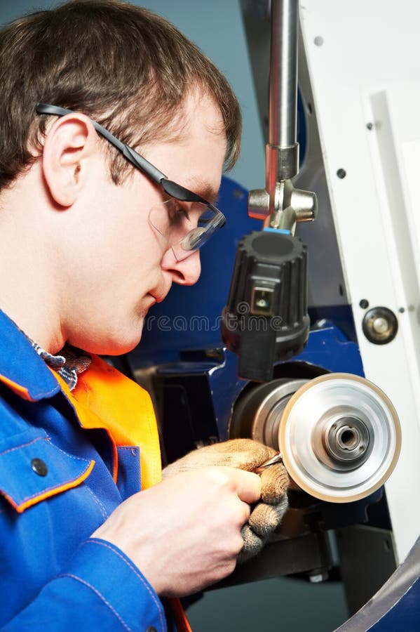 Worker at machine tool operating