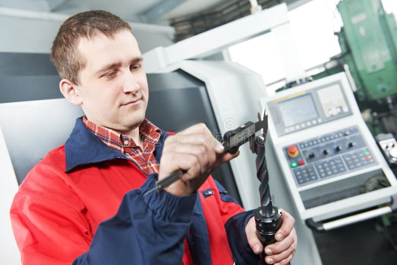 Worker measuring tool by hand royalty free stock photography
