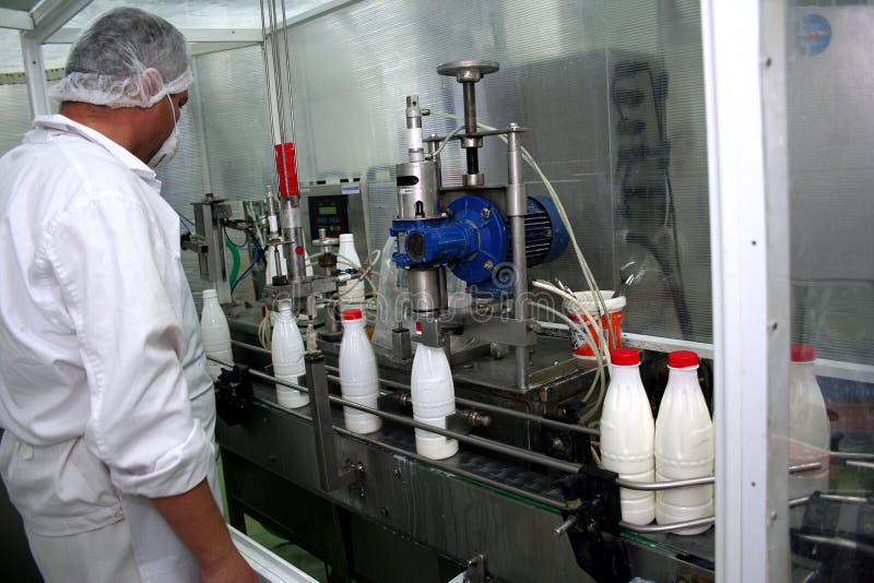 Worker in a milk factory stock image. Image of industrial 1448173