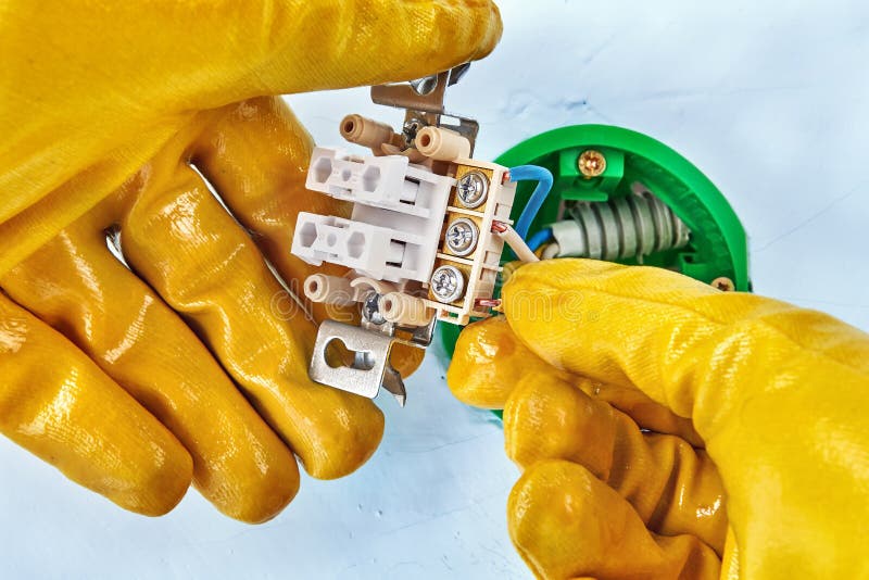 Worker mounts new push button stock images Worker mounts new push button stock images