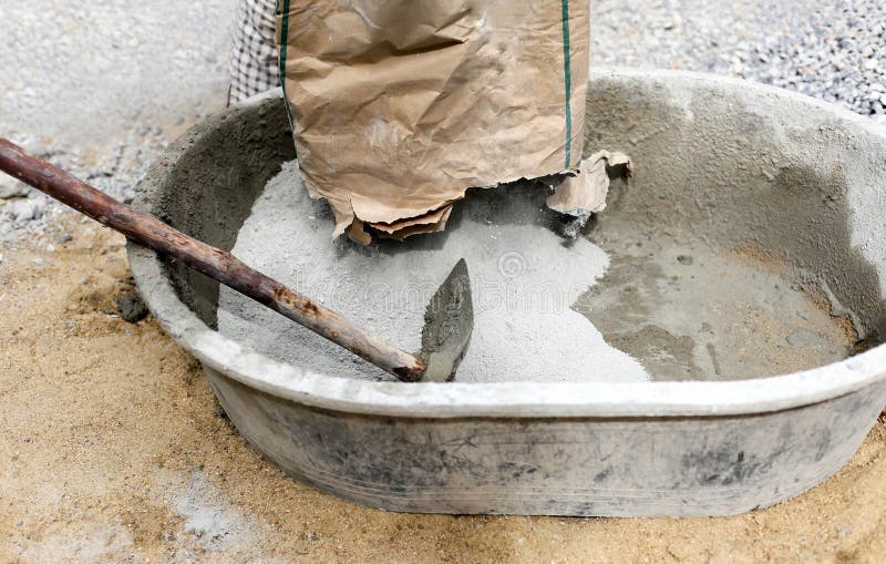 Worker Pouring Cement Powder in Mixing Tray Stock Image - Image of