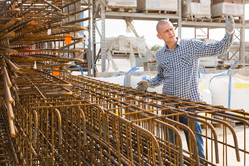 Worker Prepares Metal Rebar for Loading Onto Truck Stock Photo Image of shop, rebar 243892312