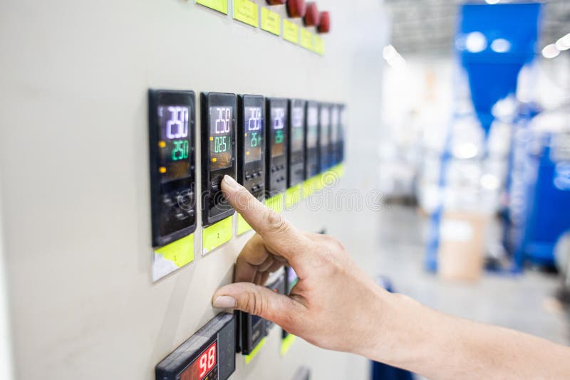 A Worker Presses a Button and Starts an Automatic Manufacturing Process