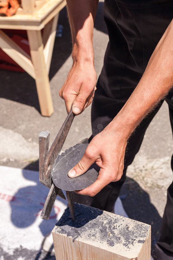 Worker Produces Roofing Slate Using a Slate Hammer. Stock Image Image
