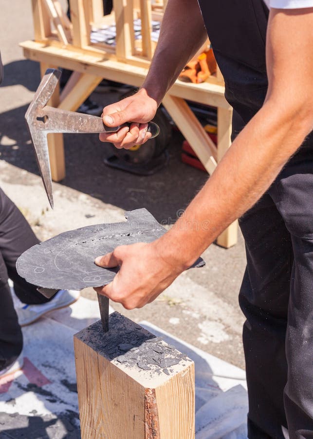 Worker Produces Roofing Slate Using a Slate Hammer. Stock Image Image