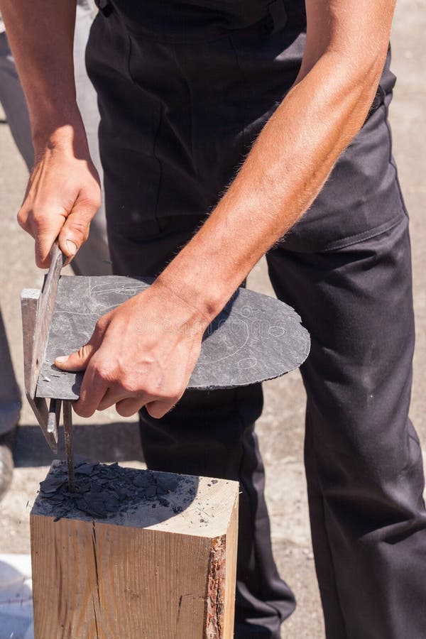 Worker Produces Roofing Slate Using a Slate Hammer. Stock Image Image