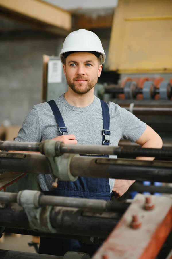 Worker in Protective Clothing in Factory Using Machine Stock Image Image of equipment