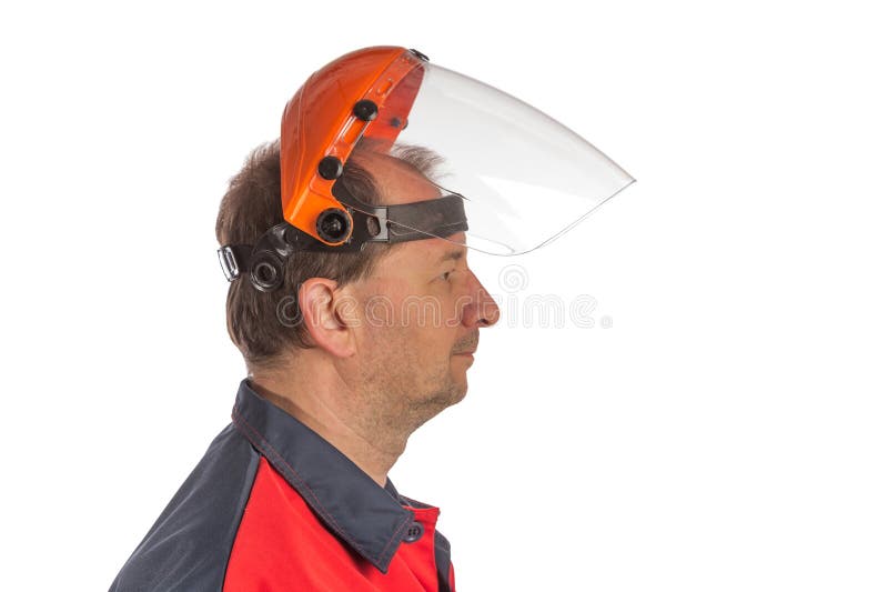 A worker in a protective mask. The image is highlighted on a white background. The case is made of orange plastic. Eye protection. Close-up. Selective focus. Side profile mask stock images, royalty-free photos and pictures