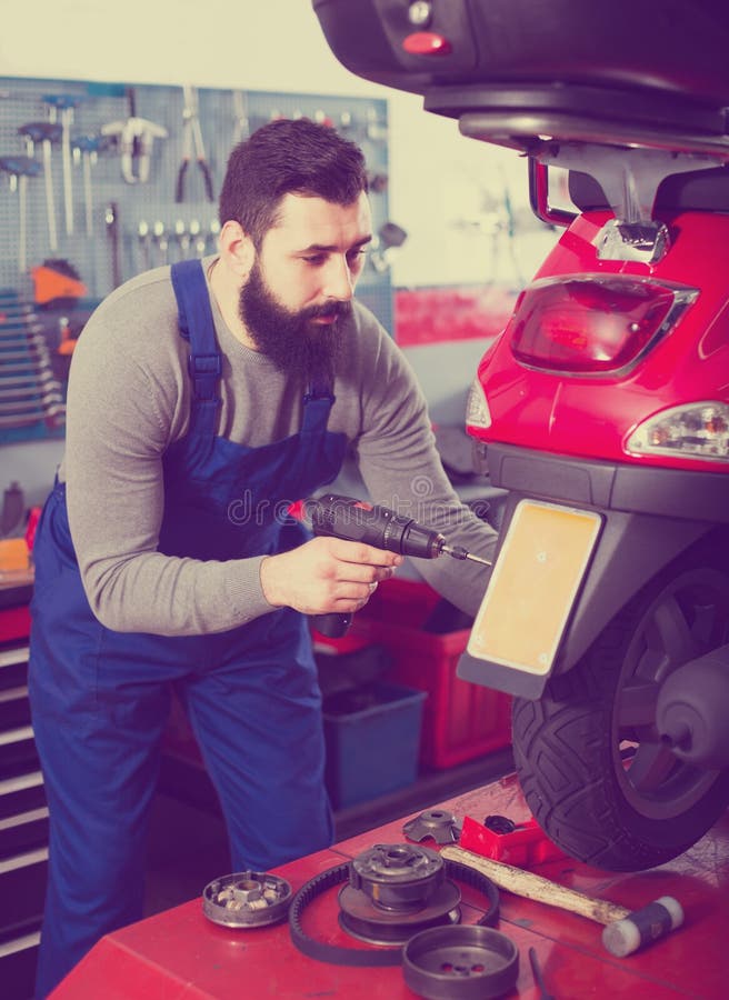 Worker Repairing in Motorcycle Stock Image Image of
