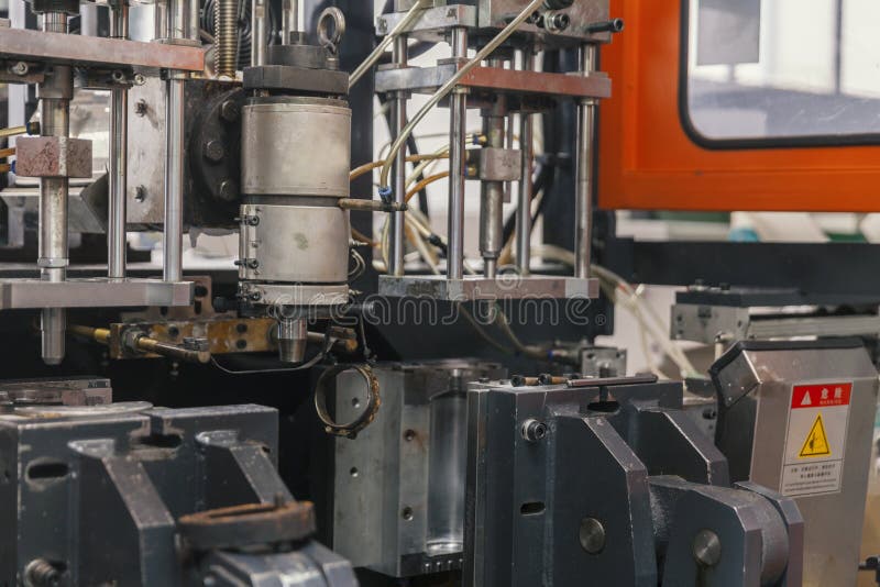 Worker Repairs a Machine for Plastic Injection Stock Photo Image of