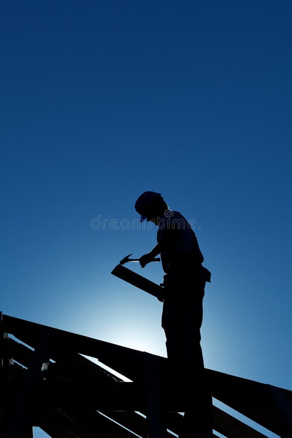 Worker on the roof structure stock photography