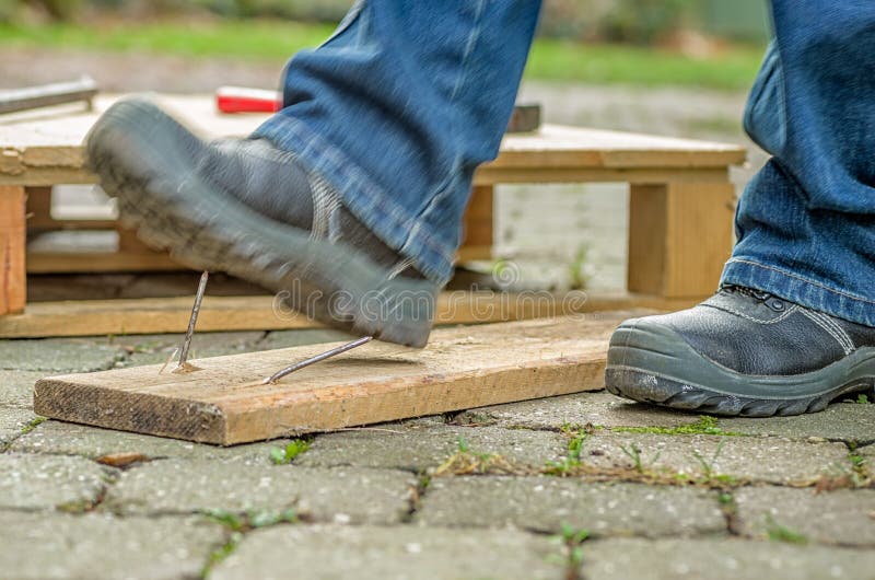 Worker With Safety Boots Steps On A Rusty Nail Stock Photo Image
