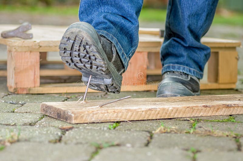 A Worker With Safety Shoes Steps On A Nail Stock Photo Image of