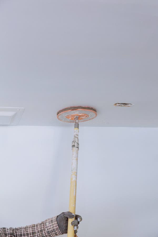 The Worker Sanded the Drywall Mud Using a Sand Trowel at the Time of