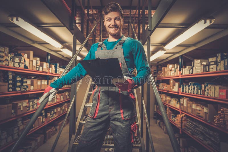 Worker in a Spare Parts Warehouse Stock Photo Image of spare, shelves