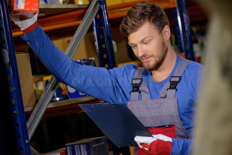 Worker in a Spare Parts Warehouse Stock Photo Image of checking