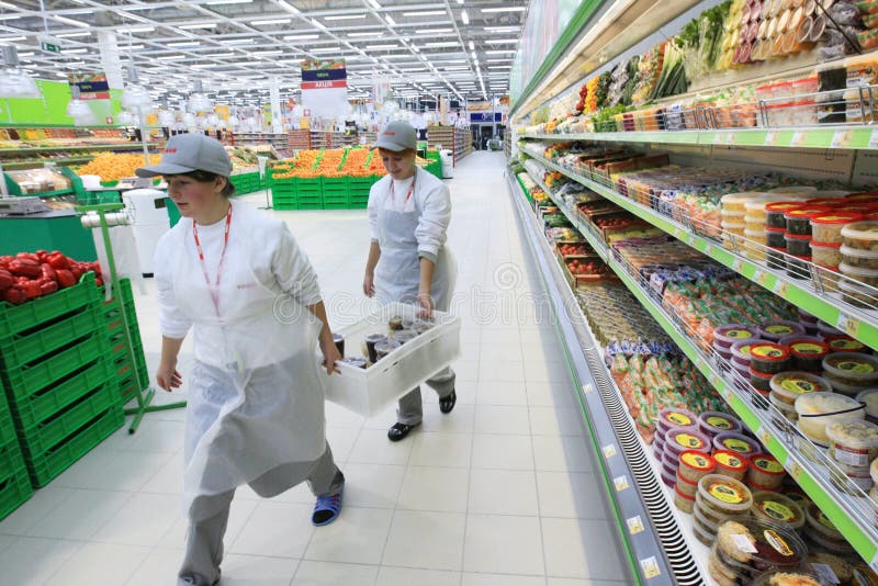 Worker in supermarket editorial photo. Image of selling 13327486