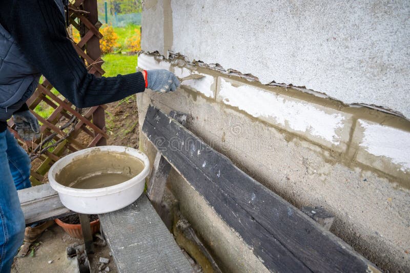 A Worker with a Trowel Cement the Wall Stock Image Image of construction, builder 218539703