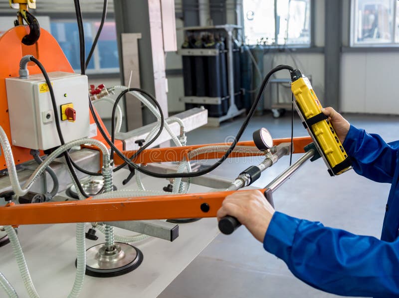 Worker Uses Suction Cups for Transporting Large Sheets of Metal Stock Photo Image of equipment